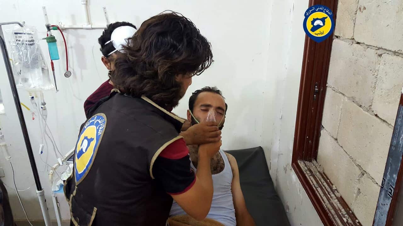 A rescue worker giving treatment to a man who was allegedly affected by chlorine gas in Saraqeb, Idlib.
