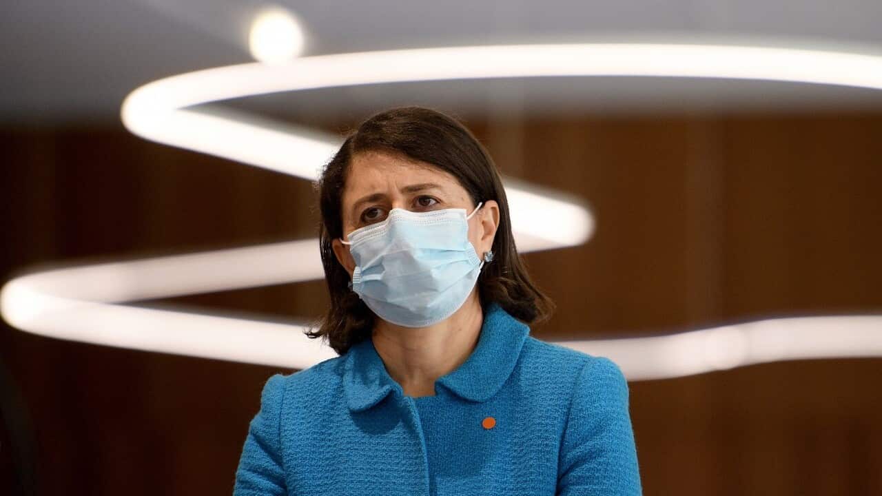 NSW Premier Gladys Berejiklian watches on during a press conference (AAP)