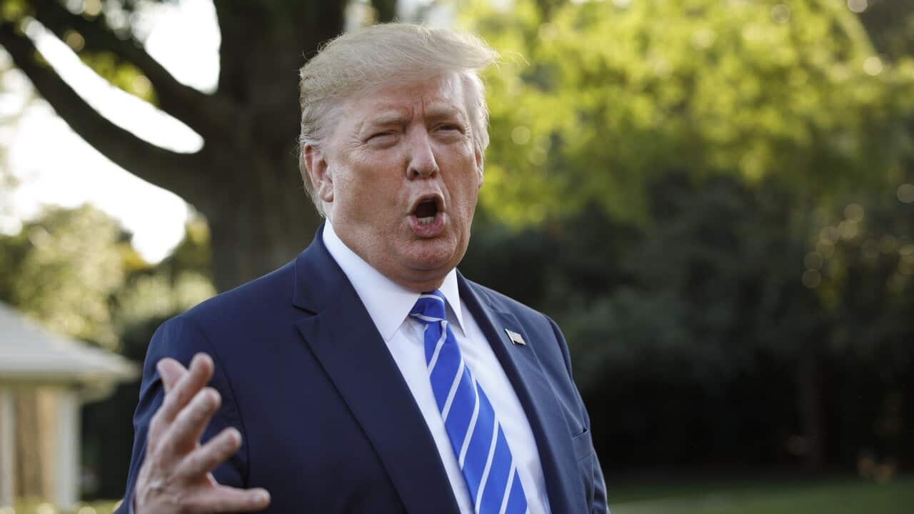 President Donald Trump talks to media before boarding Maine One at the White House in Washington, Friday, Aug. 30, 2019, en route to Camp David in Maryland. (AP Photo/Carolyn Kaster)