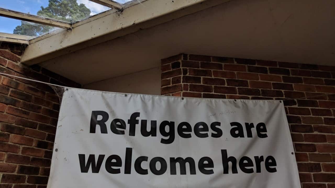 A sign welcoming refugees
