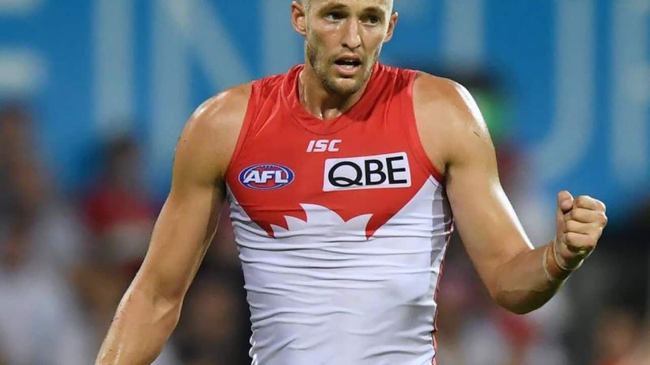 AFL player Sam Reid of the Swans celebrates scoring a goal.