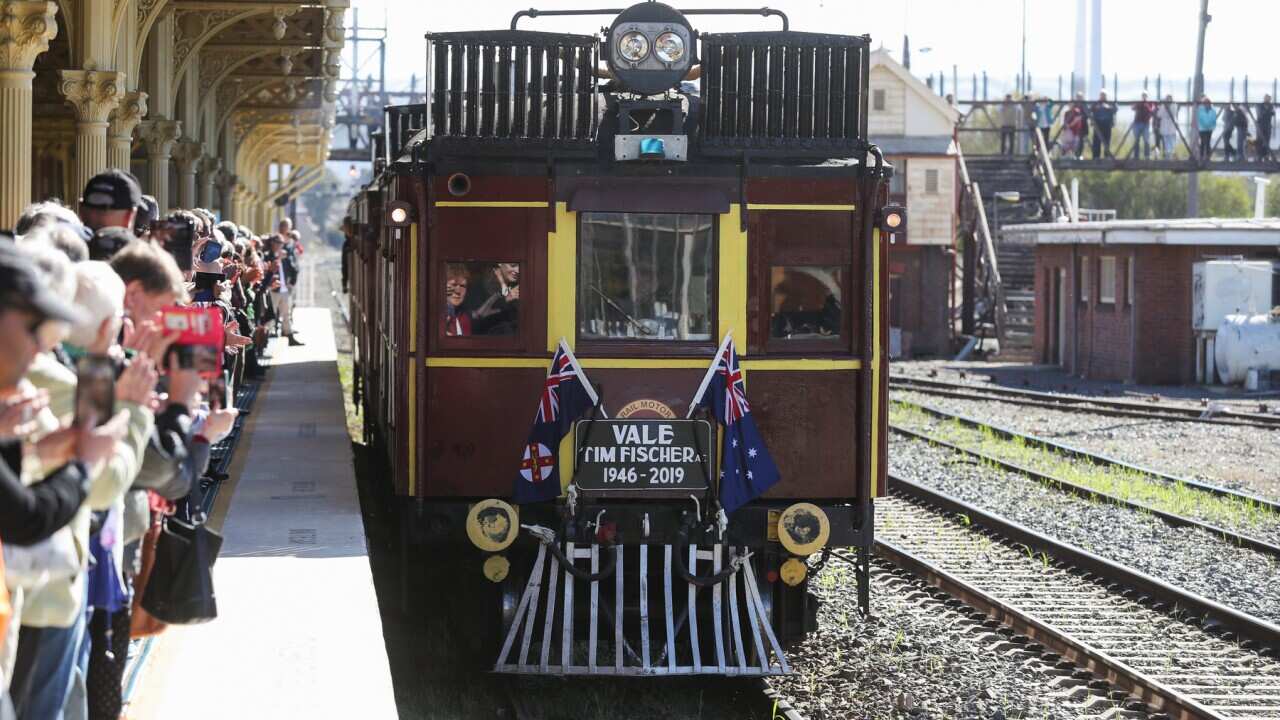 Members of the public pay their respects to former deputy prime minister and National Party leader Timothy 'Tim' Fischer at Albury Railway Station
