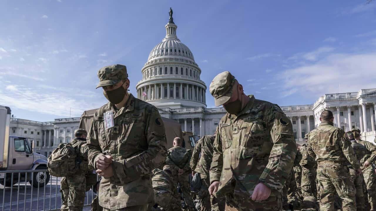 National Guard troops reinforce security around the U.S. Capitol