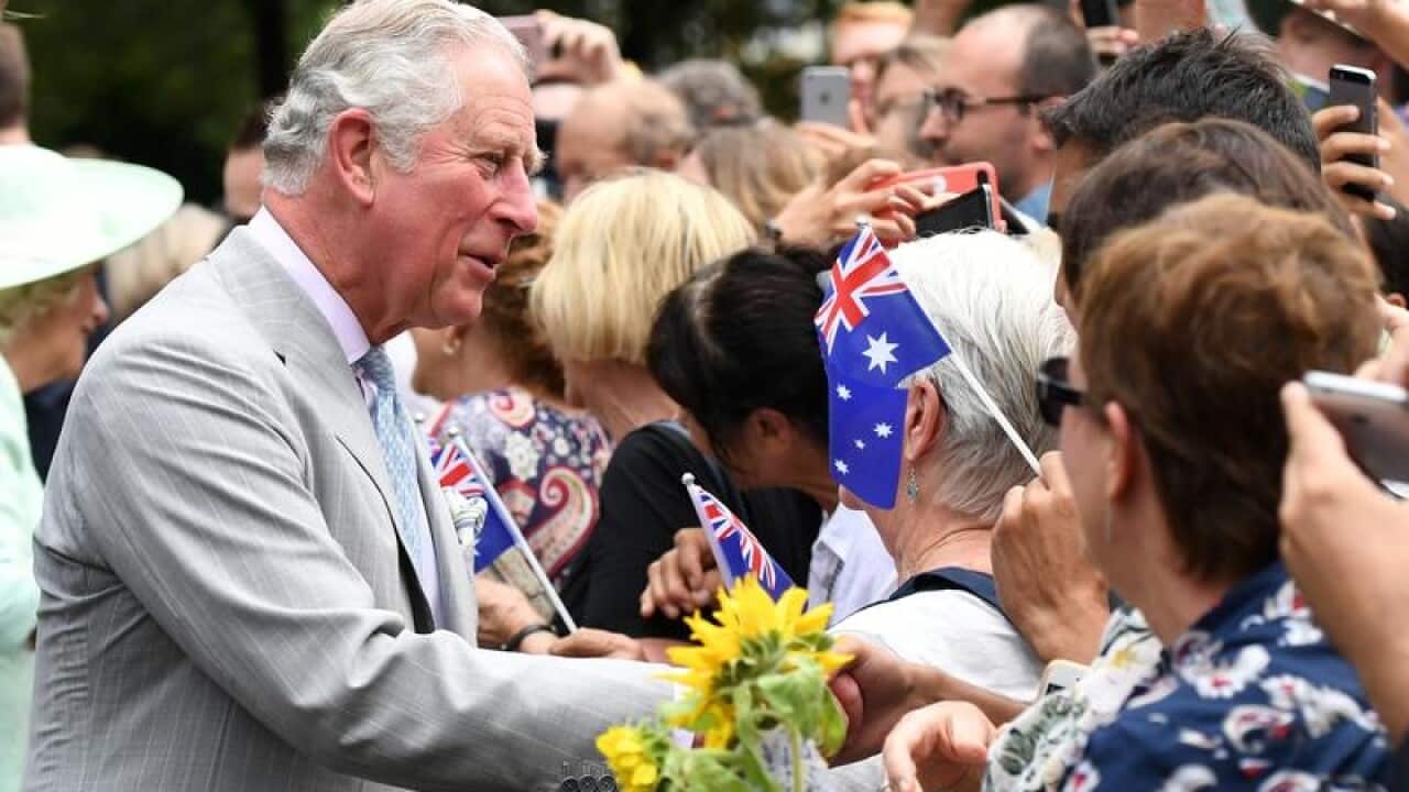 Prince Charles is greeted by members of the public in Brisbane.