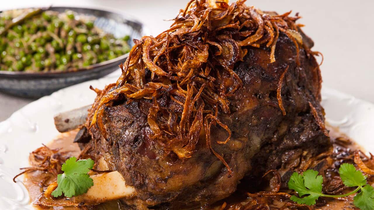 Spiced slow-roast shoulder of lamb with edgy peas