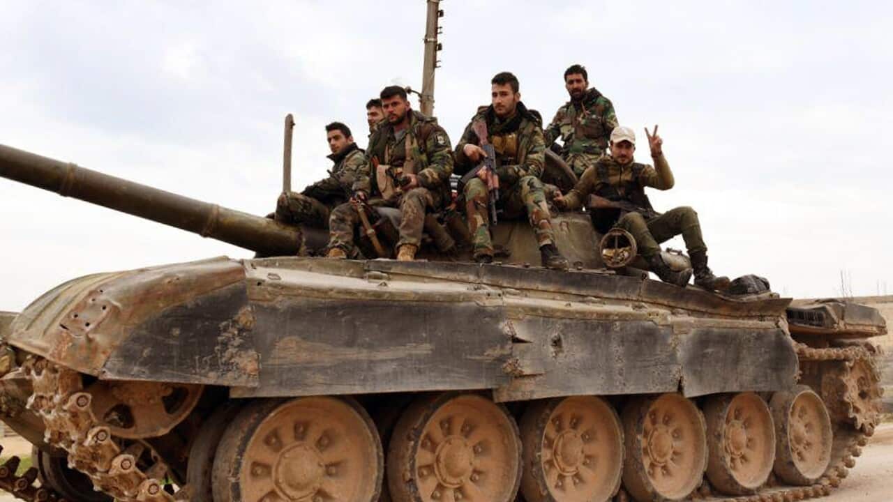 In this photo released Wednesday Feb. 5, 2020 by the Syrian official news agency SANA, shows Syrian government forces entering the village of Tel-Toukan