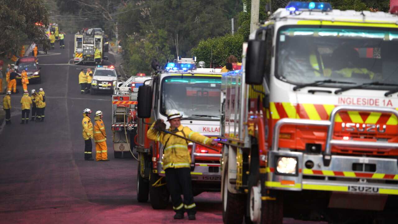 NSW Rural Fire Service crews protect properties on Canoon Rd, South Turramurra, north of Sydney, Tuesday, November 12, 2019.