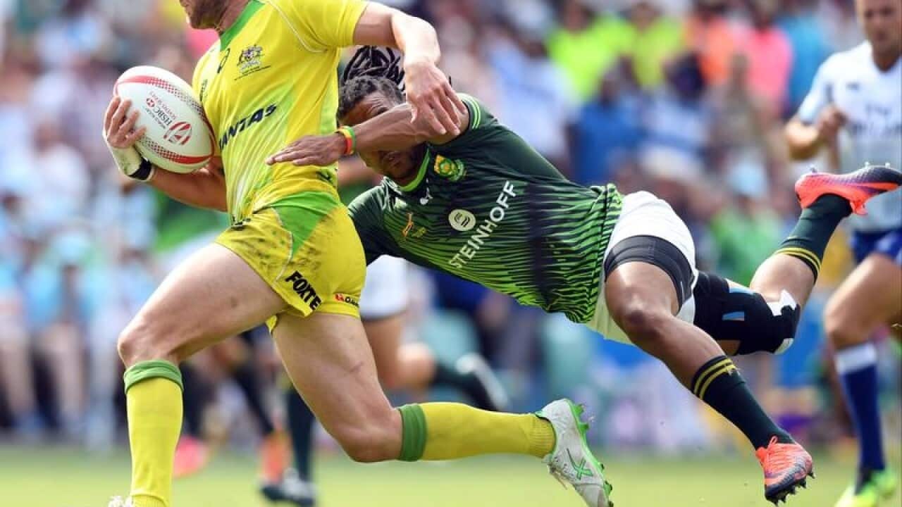 James Stannard of Australia is tackled