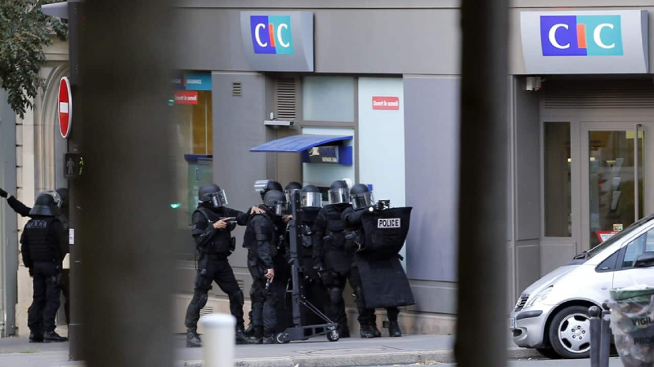 Police outside a CIC bank in Paris