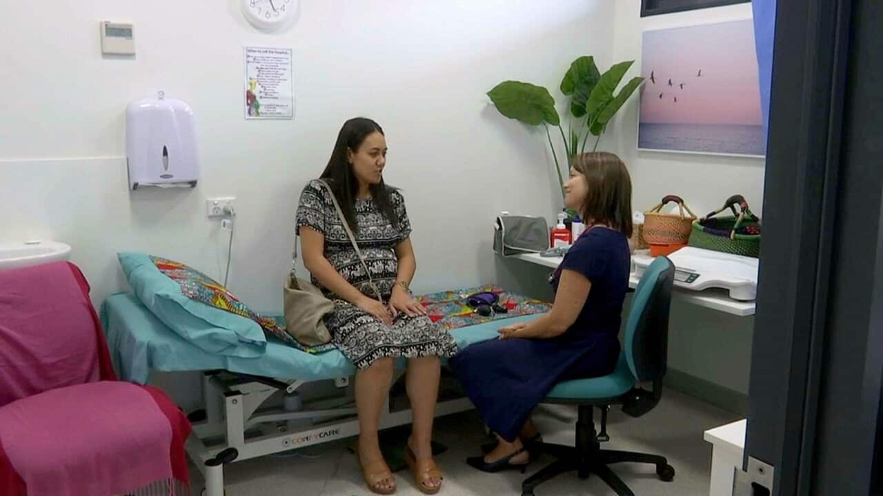 Talking to the midwife at Redbank Community Centre