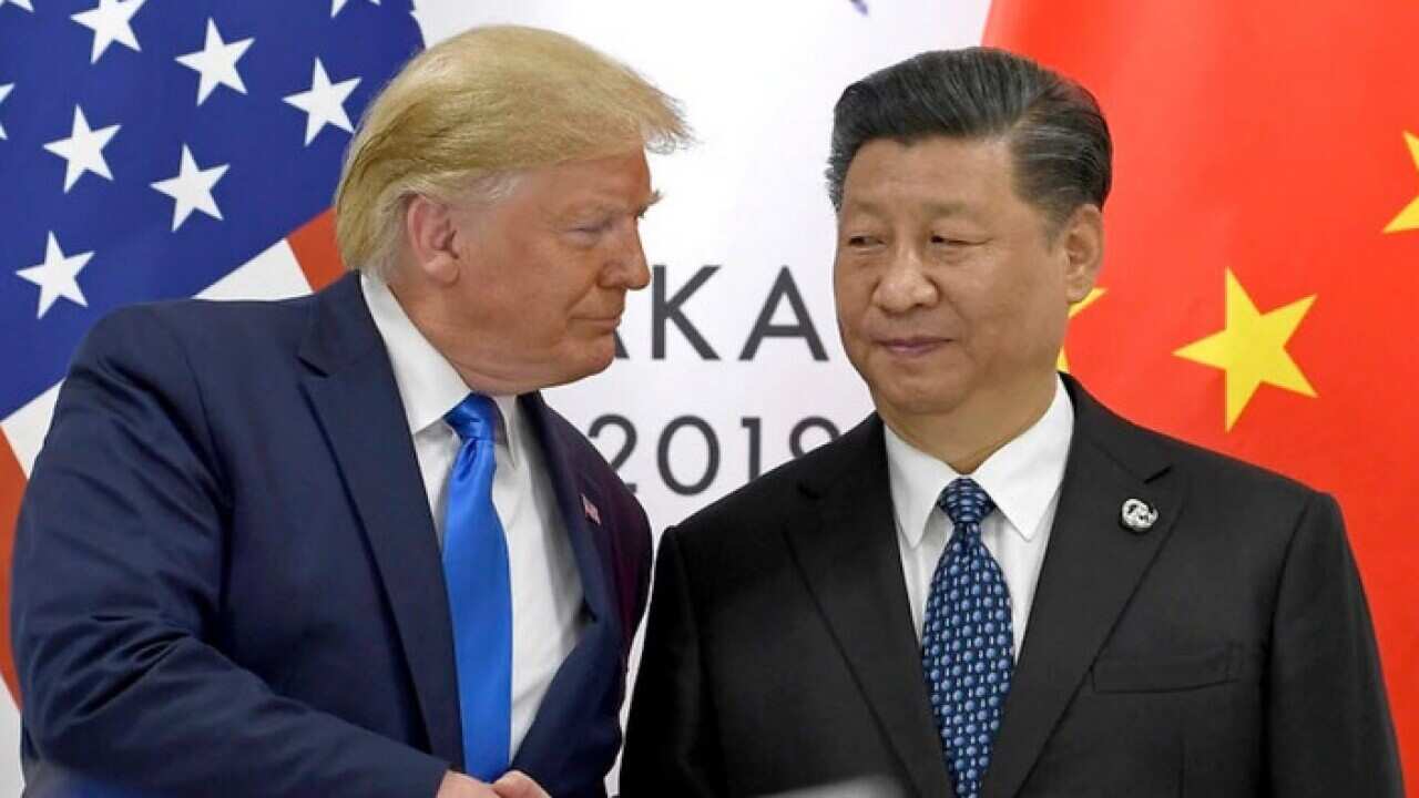 President Donald Trump shakes hands with Chinese President Xi Jinping during a meeting on the sidelines of the G20