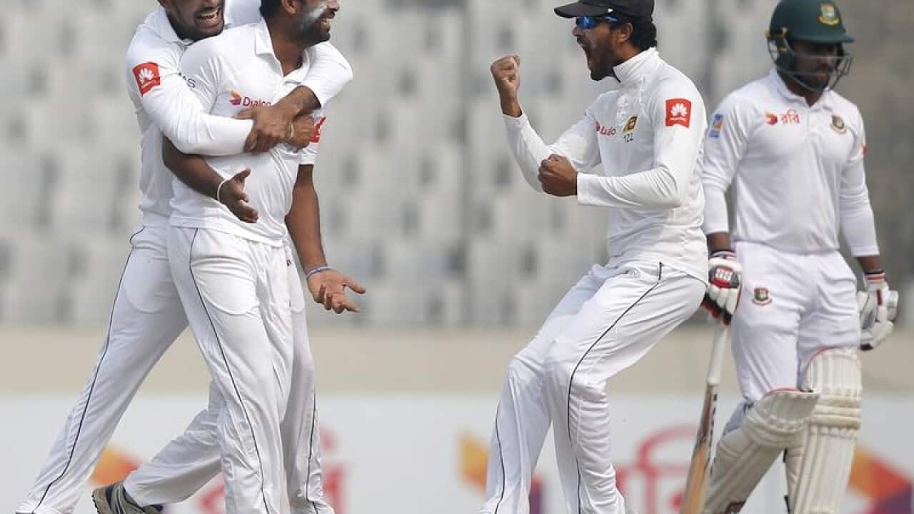 Sri Lankan players celebrate after claiming a wicket