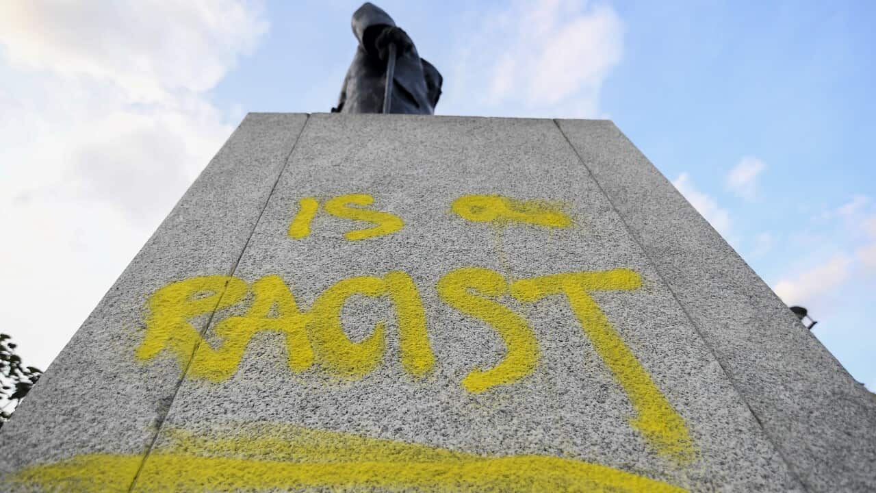 The statue of Winston Churchill in Parliament Square is seen with graffiti reading 'is a racist' on the plinth, in London, Thursday, Sept. 10, 2020.(AP Photo/Alberto Pezzali)