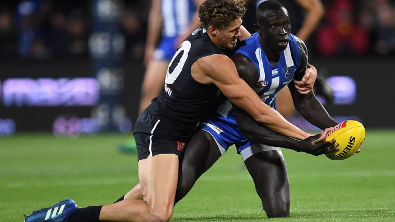 Charlie Curnow of the Blues (left) and Majak Daw