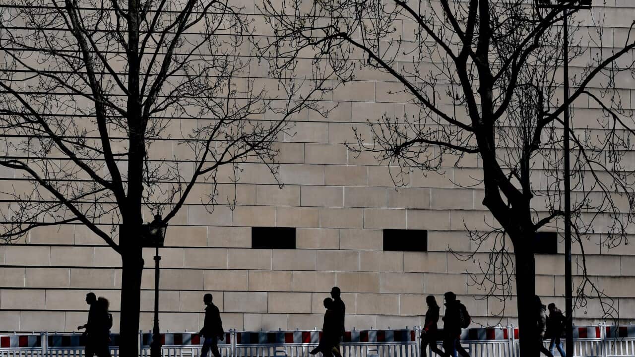 Visitors pass in front of New Synagogue, on Holocaust Remembrance Day in Dresden.