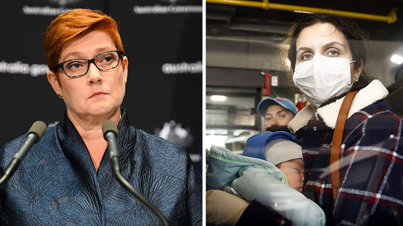 (L) Senator Marise Payne, minister for foreign affairs (R) Mother wearing face mask.