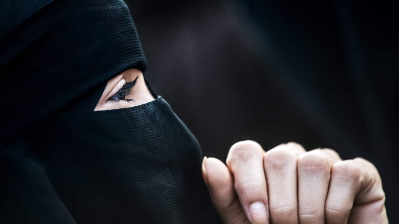 A woman wearing a niqab. 