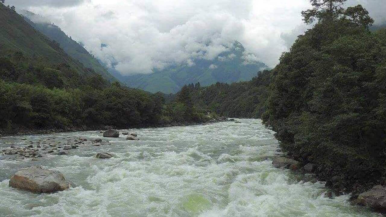 The river the children cross daily in remote N.E. areas