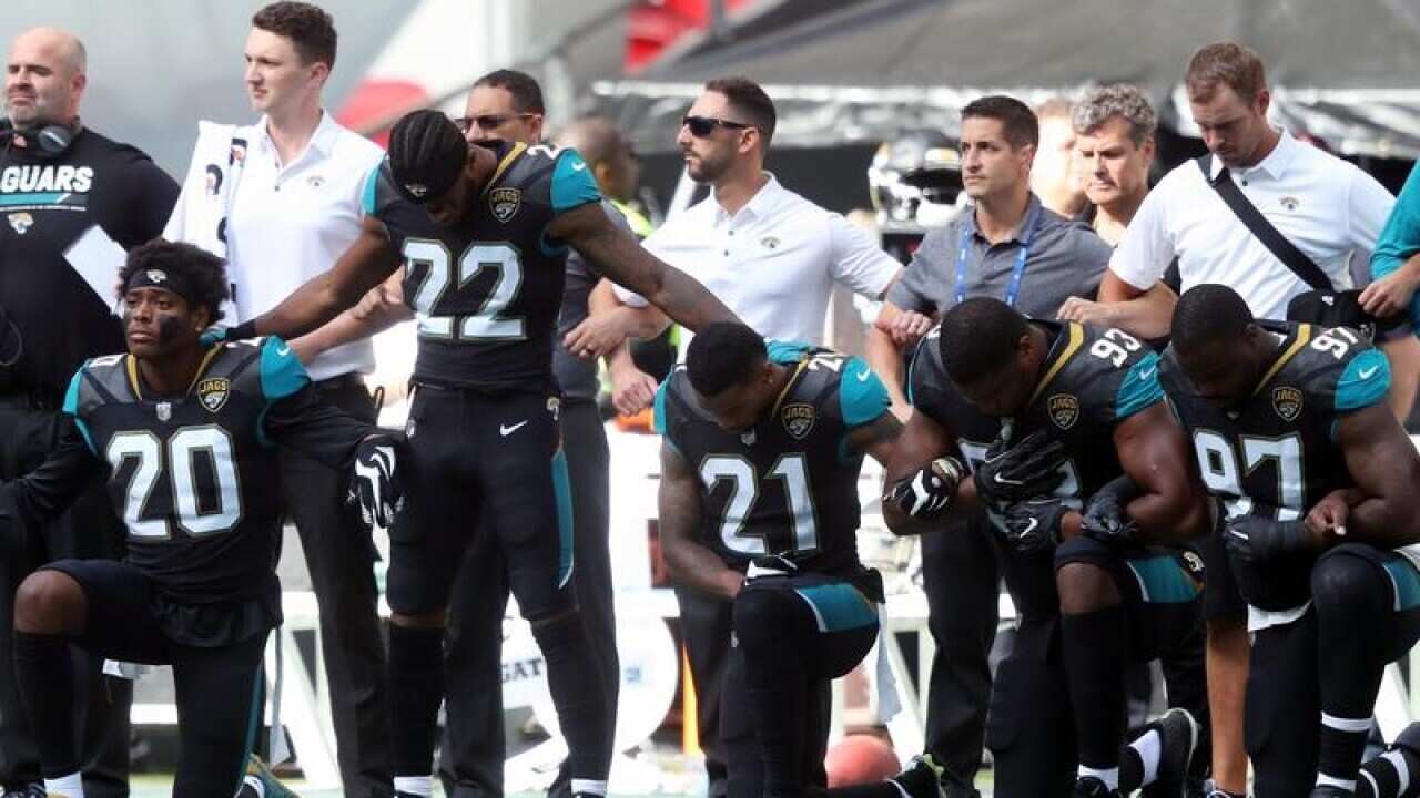 The Jacksonville Jaguars kneeling