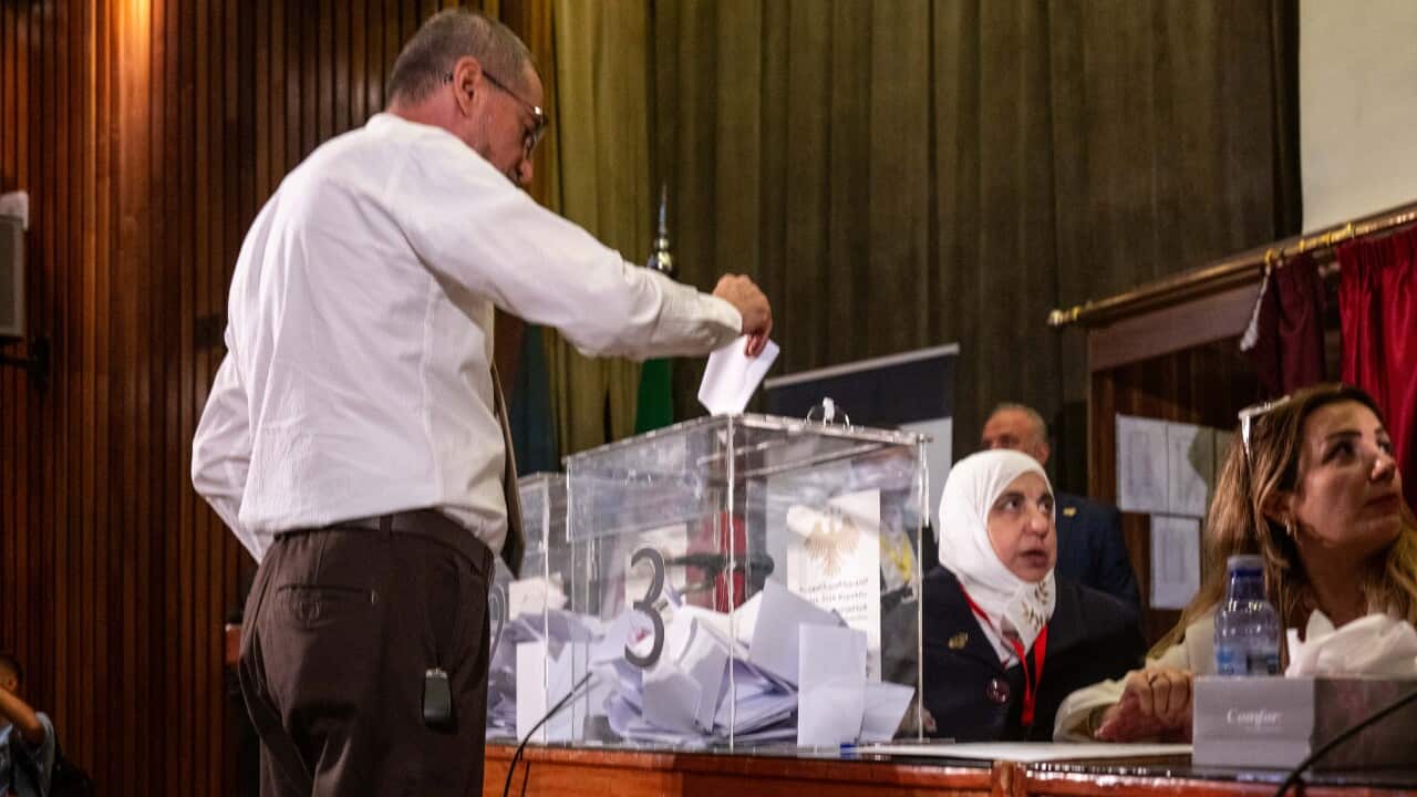 Voting at the Damascus polling station at the National Library (AAP)