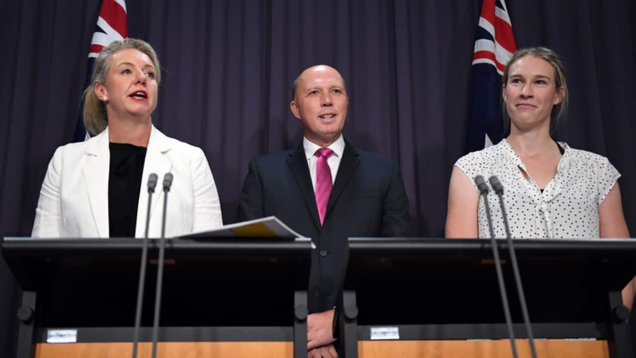 (L to R) Minister for Sport Bridget McKenzie, Minister for Home Affairs Peter Dutton and gold medallist Kim Brennan