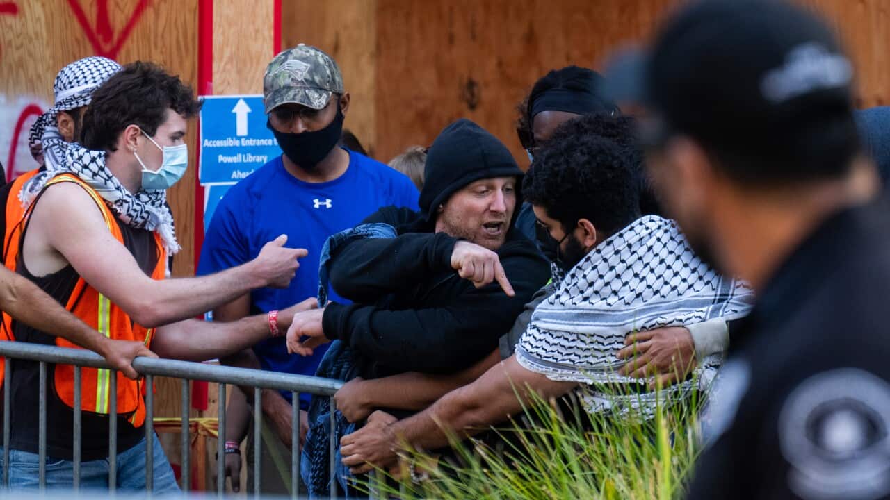 Men seen arguing during a protest