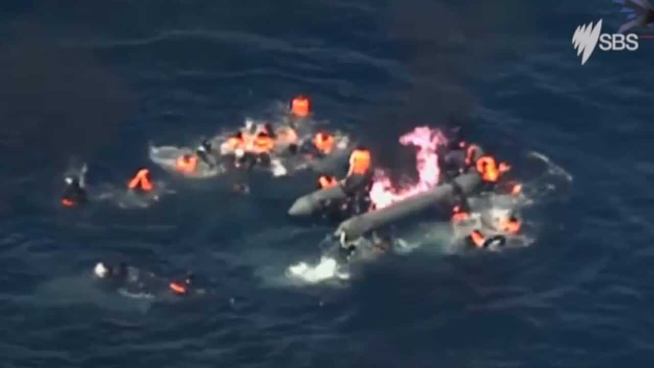 Migrants off the coast of Spain narrowly escape a burning boat.
