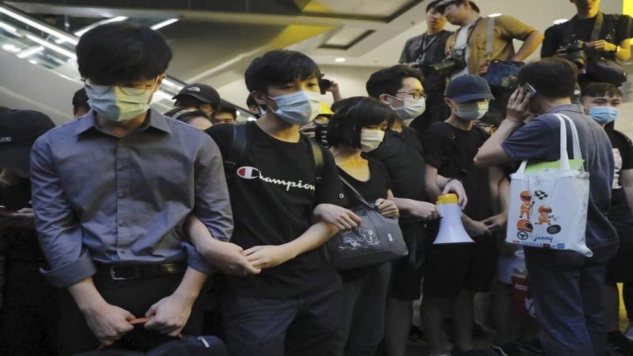 Protesters block the lobby of the Hong Kong Revenue Tower.