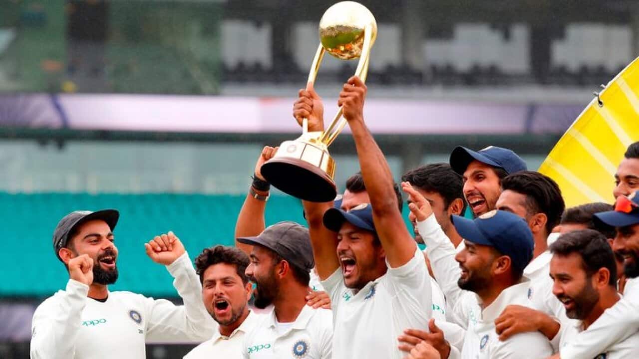 India's captain Virat Kohli (L) celebrates with teammates