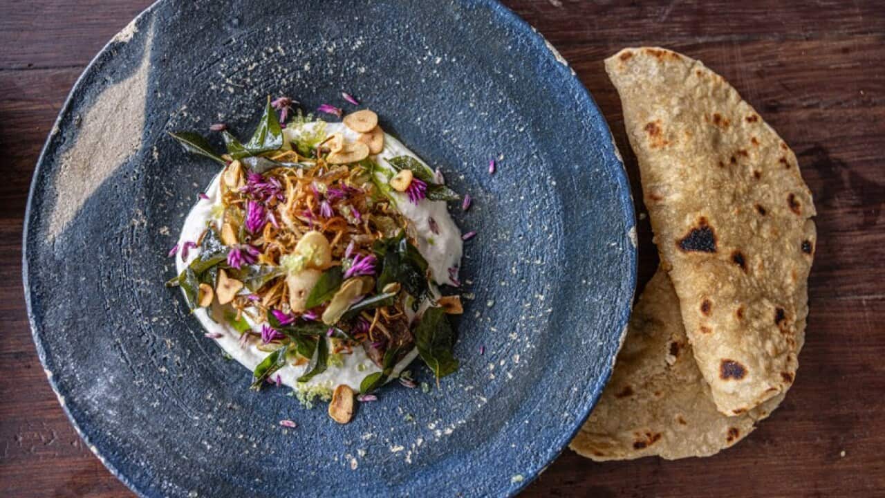 Fermented rainforest yam roti, smoked kangaroo, sesame cream, hot sauce and crispies