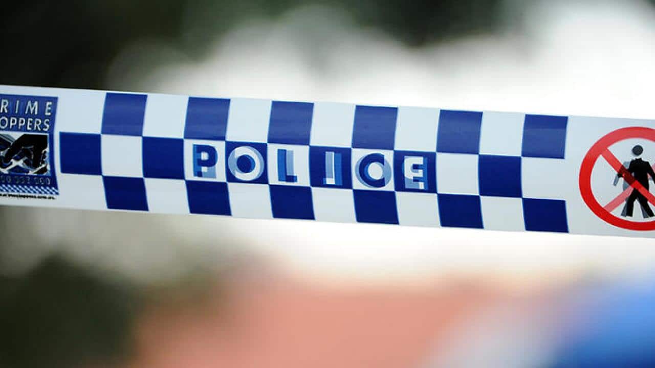 Police tape outside a home where a six week-old girl was found dead in a house in Newcastle, Friday, July 24, 2015. (AAP Image/Joel Carrett) NO ARCHIVING