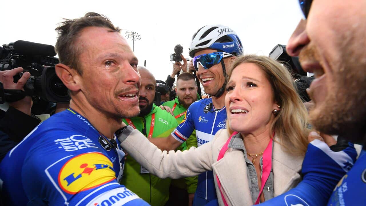 Philippe Gilbert (L) reacts after winning the 117th Paris-Roubaix (Getty)