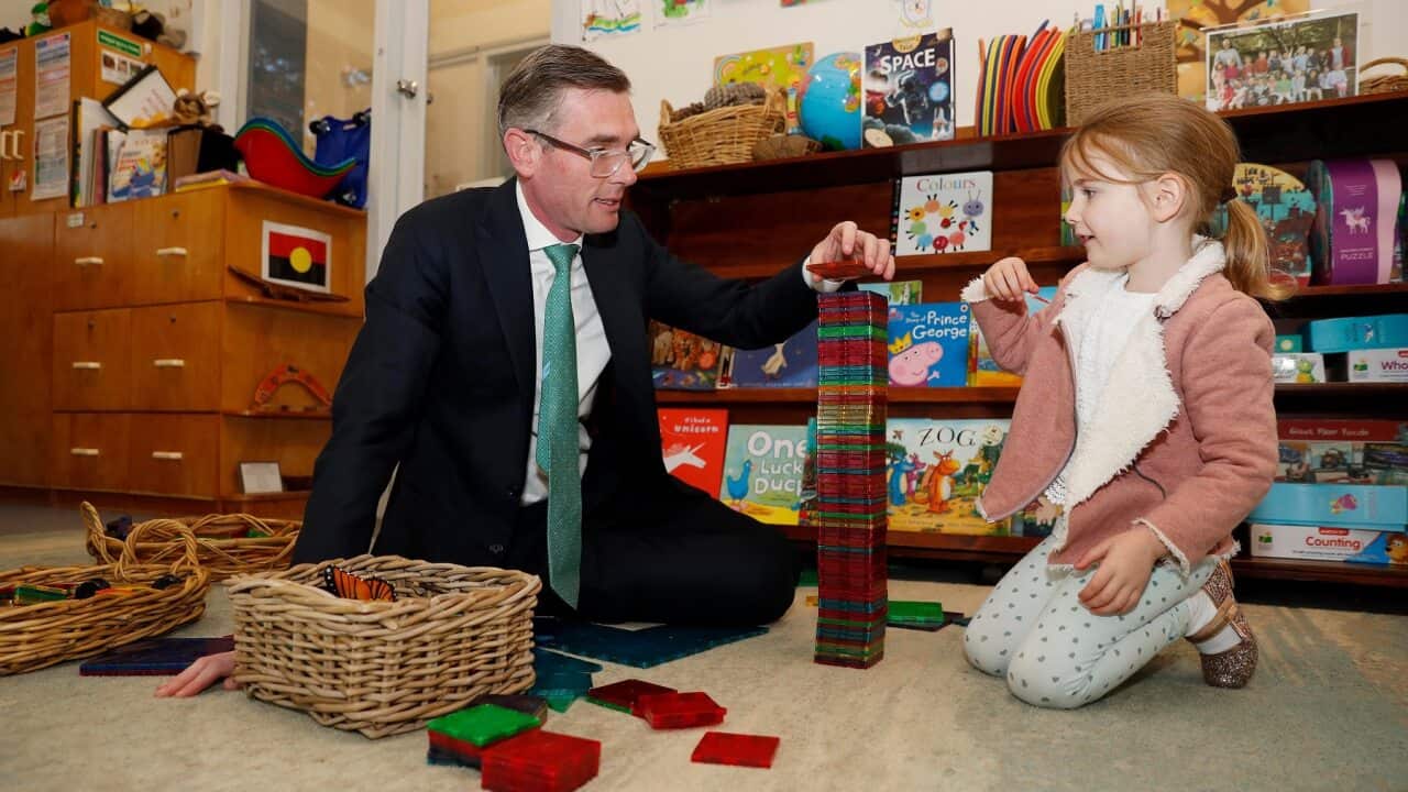 NSW Premier Dominic Perrottet plays with his daughter at a preschool in Sydney (AAP)