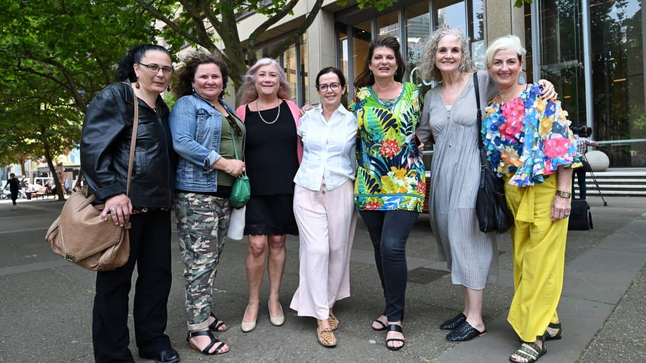 Women involved in the class action over vaginal mesh implants outside the Federal Court in Sydney
