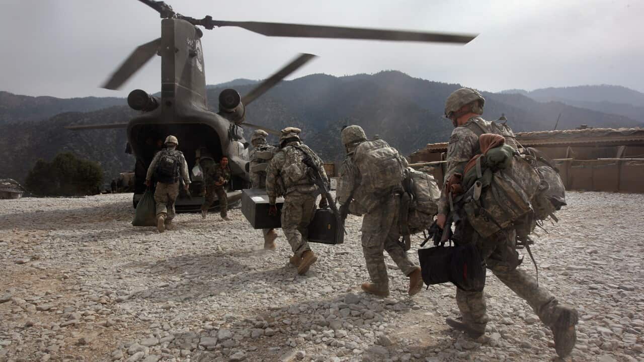 US soldiers board an Army Chinook helicopter in Korengal Valley, Afghanistan. Mr Trump had tried to bring the Taliban to the table, until talks fell through.