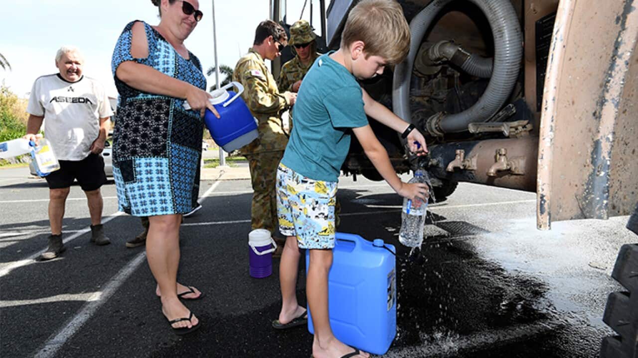 People Filling Water