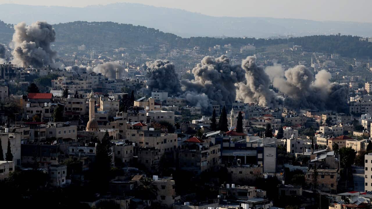 Smoke rises as the Israeli army detonate explosives in a residential area in the West Bank camp of Jenin, 02 February 2025.