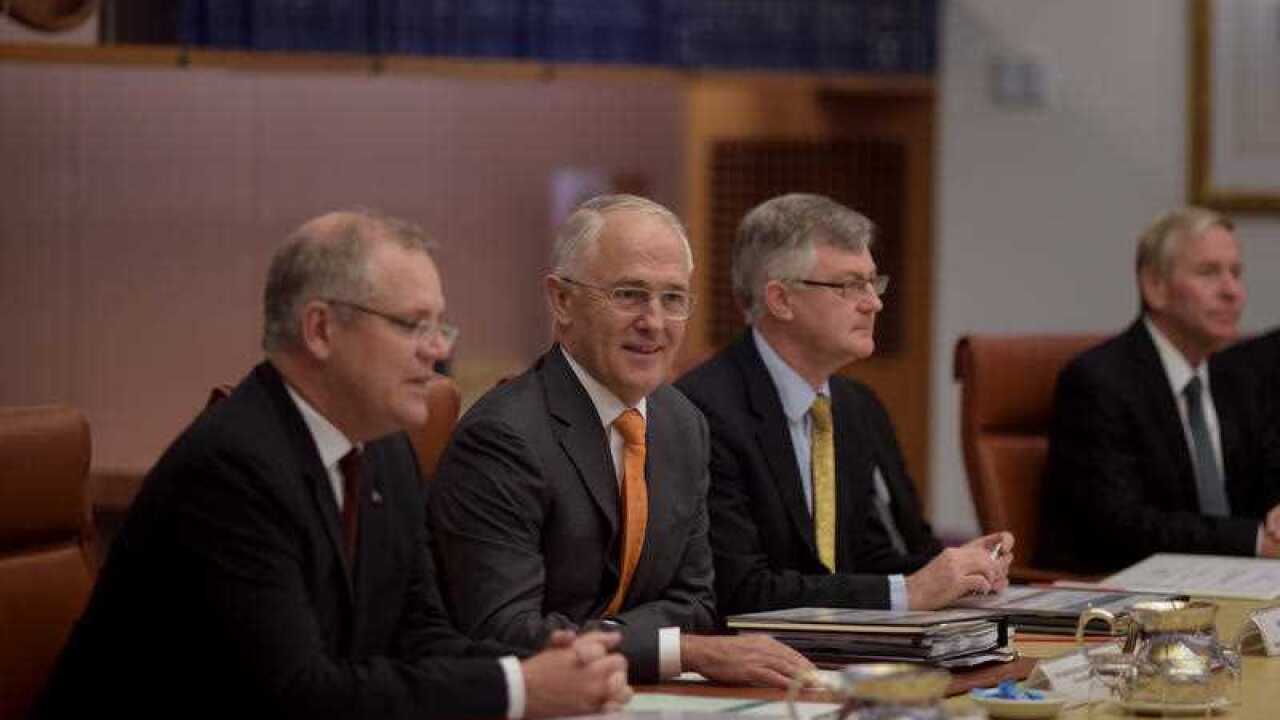 Australian Prime Minister Malcolm Turnbull speaks to Premiers and Chief Ministers at the start of the COAG meeting at Parliament House in Canberra.