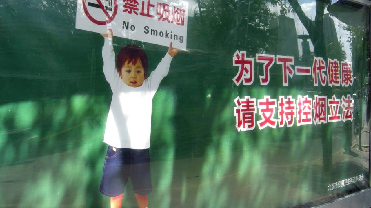 (File Image) An anti-smoking advertisement displayed at a park in Beijing on May 29, 2014.