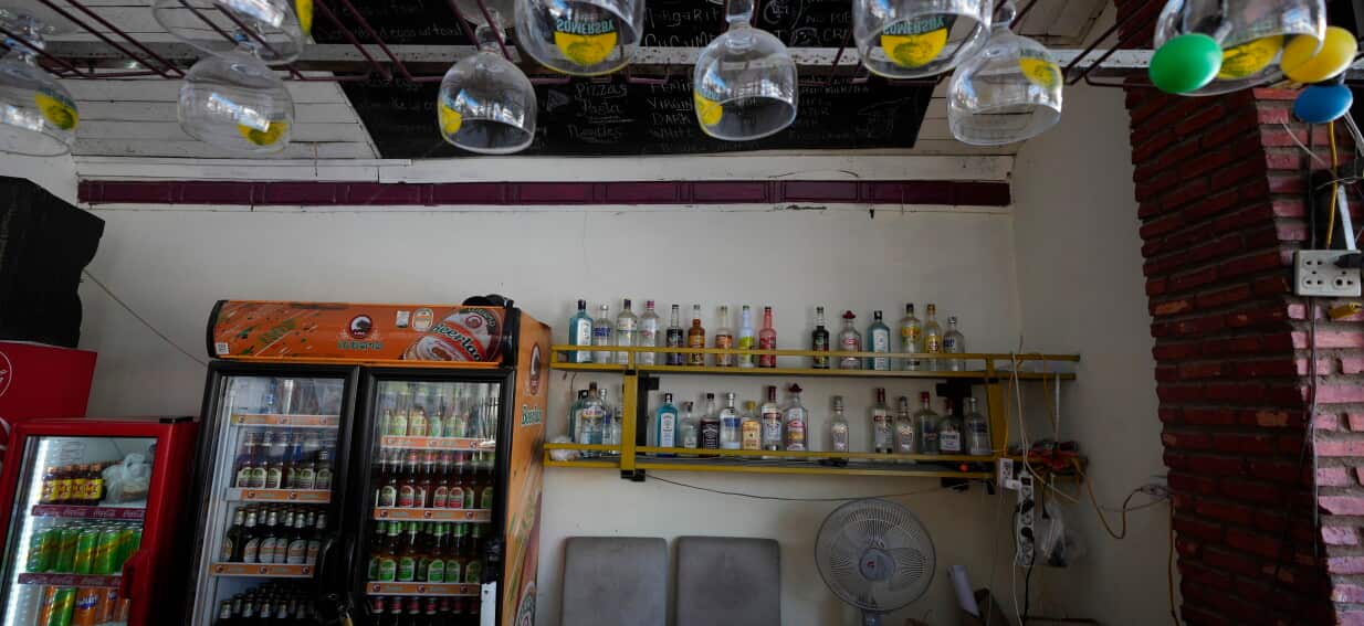 Laos says lack of autopsies means cause of tourist deaths cannot be proven as methanol