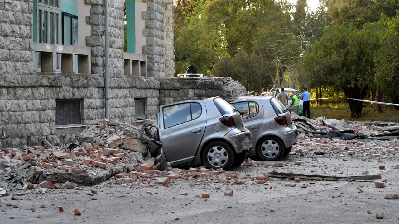 Damaged cars outside the Faculty of Geology building after an earthquake in Tirana.