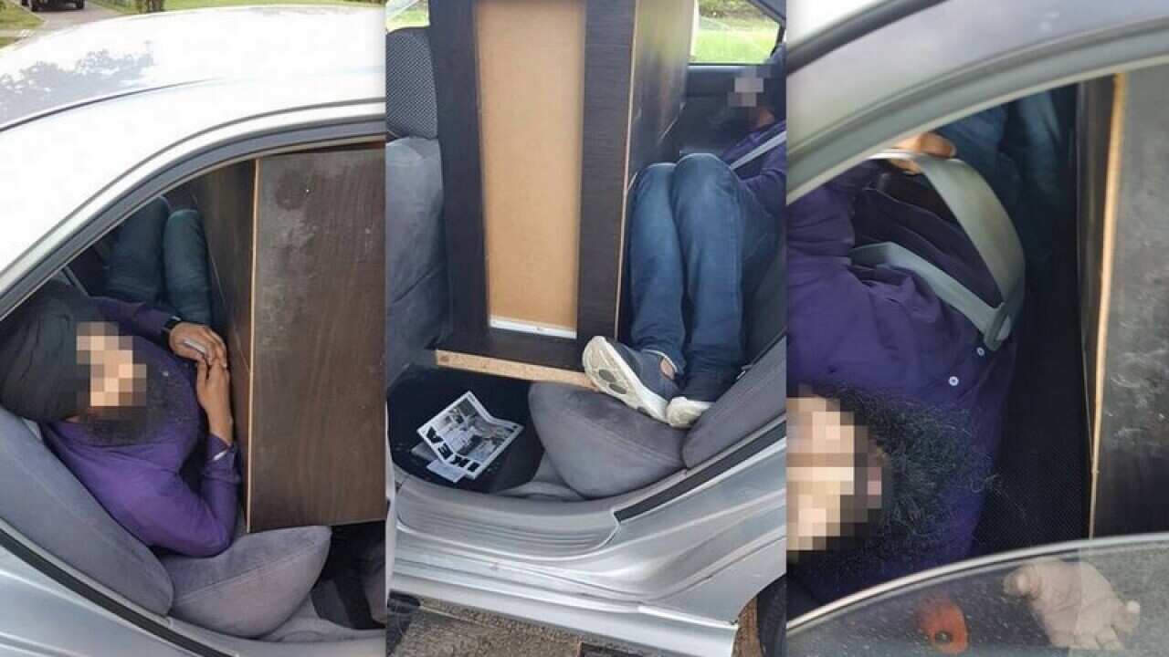 men fined with cabinet in rear