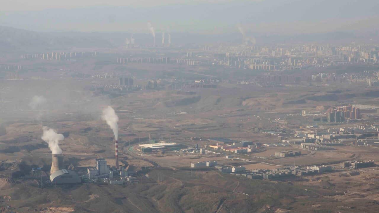 Smoke and steam rise from towers at the coal-fired Urumqi Thermal Power Plant in Urumqi in western China's Xinjiang region.