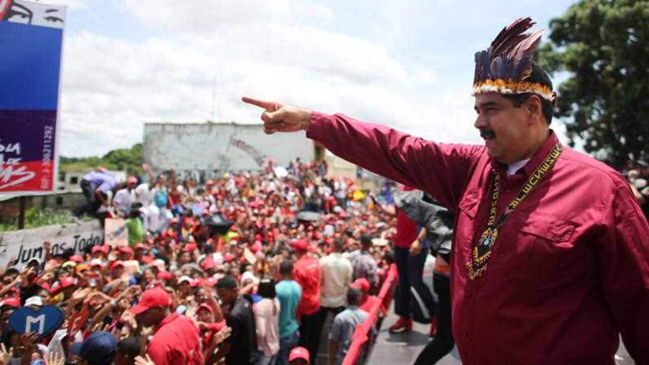 A handout photograph made available by Miraflores shows President, Nicolas Maduro, during an event to present his government plan as part of his electoral campaign around the country.