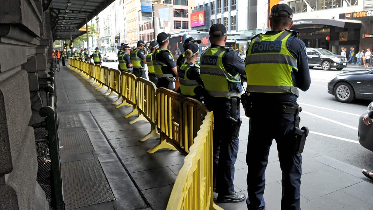 Victoria police stand guard
