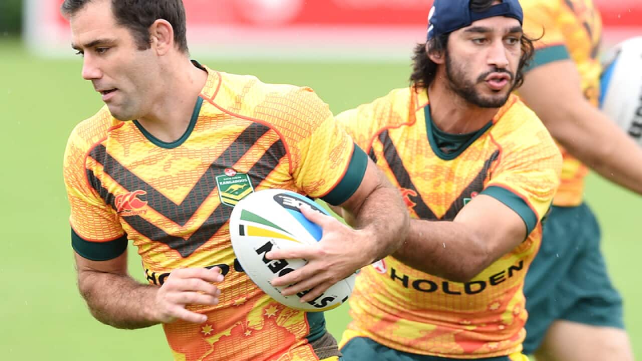Australian Kangaroos players Cameron Smith (L) and Johnathan Thurston