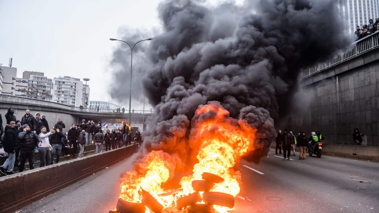 French and european taxi drivers clash with riot police as they attempt to disrupt rush hour traffic on the ring-road around Paris