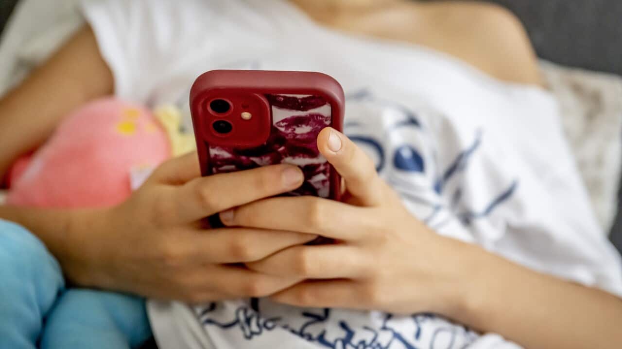 A teenage girl on her cell phone