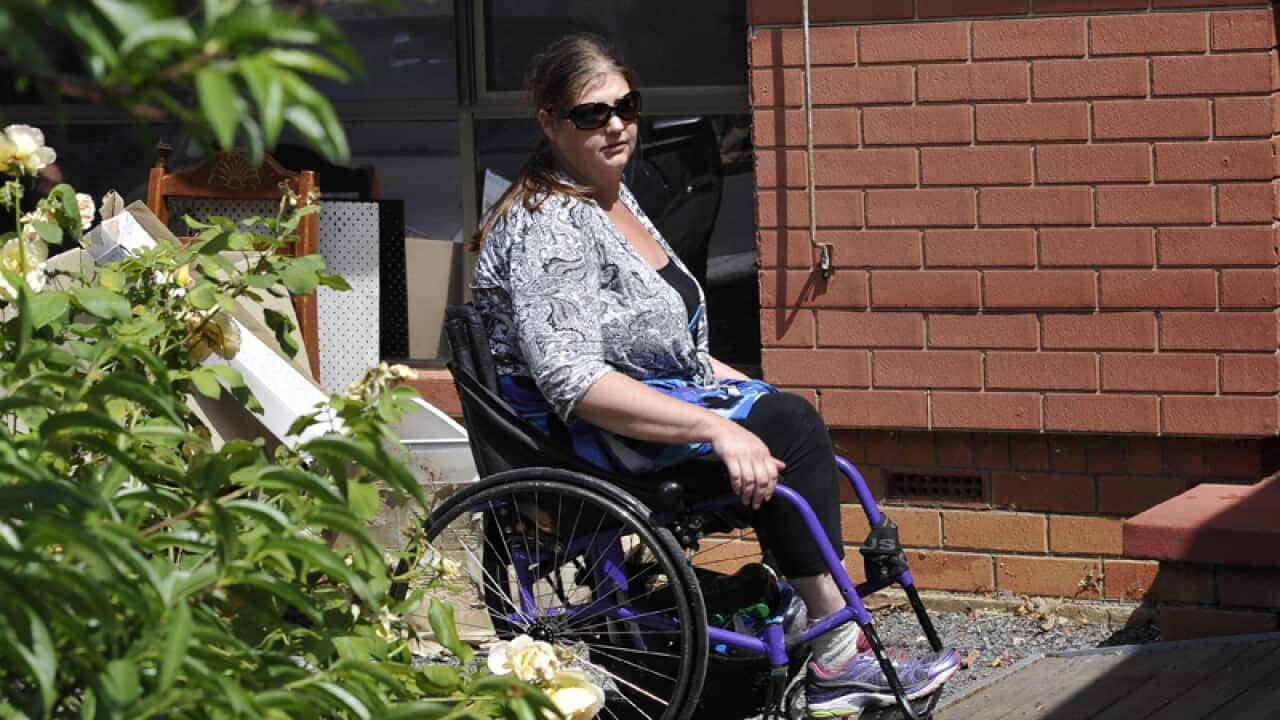 Hazel Passmore is seen leaving her property in Davoren Park