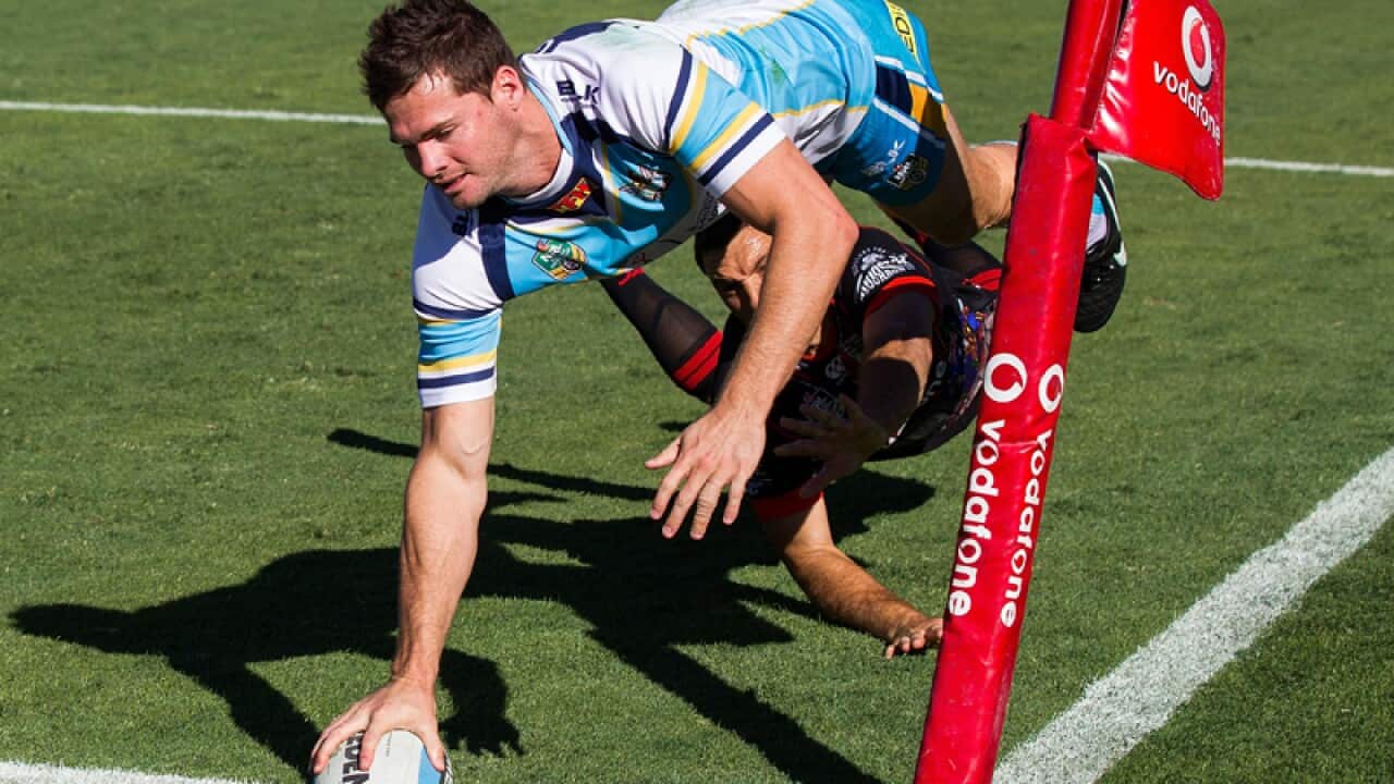 Anthony Don of the Gold Coast Titans scores against the Warriors